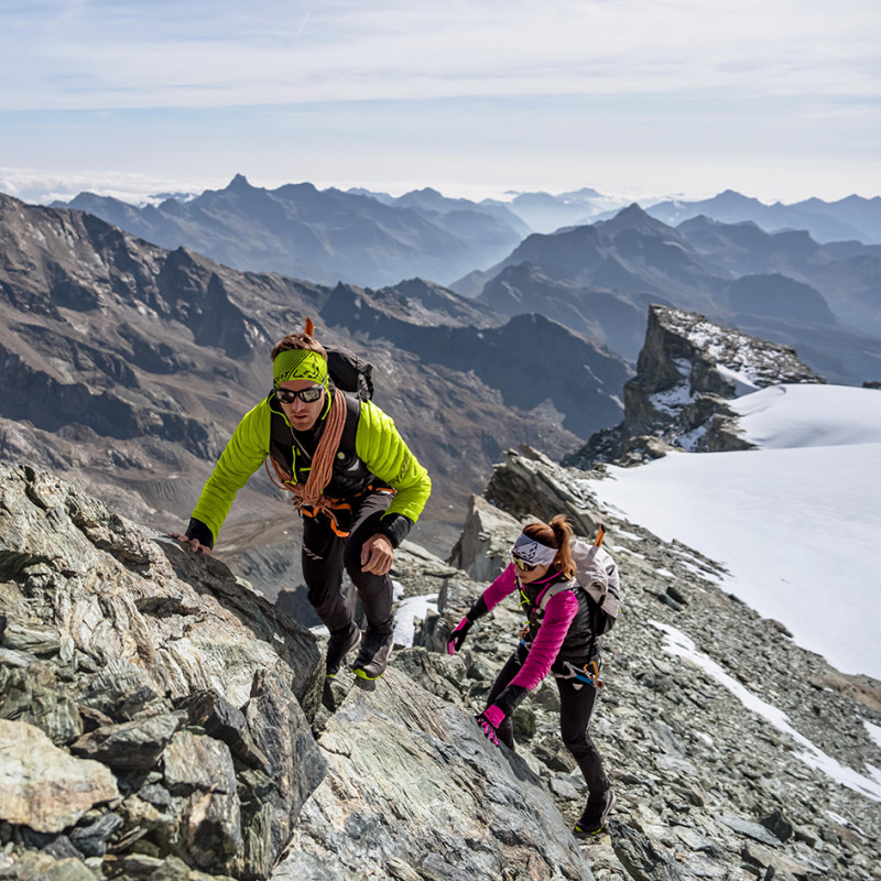 Two mountain athletes on an easy scrambling section on a ridge