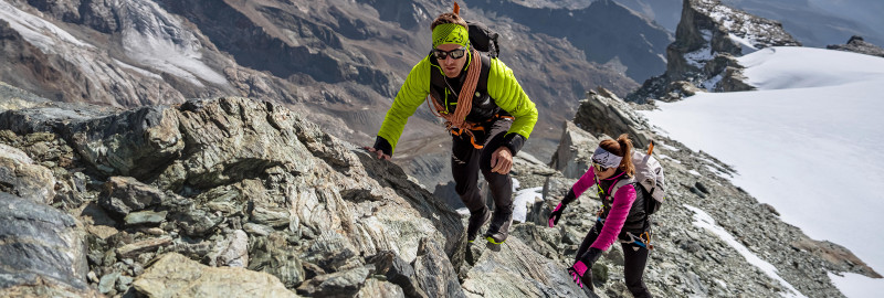 Two mountain athletes on an easy scrambling section on a ridge